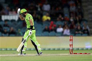 CANBERRA, AUSTRALIA - DECEMBER 14: Alex Ross of the Thunder
walks from the field after being dismissed by Matthew Kuhnemann of the Heat during the Big Bash League match between the Sydney Thunder and the Brisbane Heat at Manuka Oval, on December 14, 2020, in Canberra, Australia. (Photo by Brendon Thorne/Getty Images)