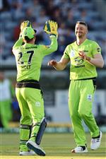 CANBERRA, AUSTRALIA - DECEMBER 14: Daniel Sams of the Thunder celebrates after claiming the wicket of Sam Heazlett of the Heat during the Big Bash League match between the Sydney Thunder and the Brisbane Heat at Manuka Oval, on December 14, 2020, in Canberra, Australia. (Photo by Brendon Thorne/Getty Images)