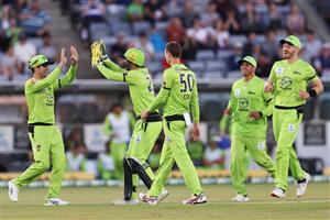 CANBERRA, AUSTRALIA - DECEMBER 14: Jonathan Cook of the Thunder celebrates after claiming the wicket of Max Bryant of the Heat during the Big Bash League match between the Sydney Thunder and the Brisbane Heat at Manuka Oval, on December 14, 2020, in Canberra, Australia. (Photo by Brendon Thorne/Getty Images)