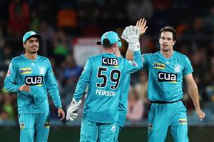 CANBERRA, AUSTRALIA - DECEMBER 14: Jack Wildermuth of the Heat celebrates with team mates after claiming the wicket of Usman Khawaja of the Thunder during the Big Bash League match between the Sydney Thunder and the Brisbane Heat at Manuka Oval, on December 14, 2020, in Canberra, Australia. (Photo by Brendon Thorne/Getty Images)