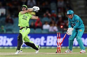 CANBERRA, AUSTRALIA - DECEMBER 14: Alex Ross of the Thunder
is bowled by Matthew Kuhnemann of the Heat during the Big Bash League match between the Sydney Thunder and the Brisbane Heat at Manuka Oval, on December 14, 2020, in Canberra, Australia. (Photo by Brendon Thorne/Getty Images)