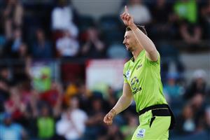 CANBERRA, AUSTRALIA - DECEMBER 14: Daniel Sams of the Thunder celebrates after claiming the wicket of Sam Heazlett of the Heat during the Big Bash League match between the Sydney Thunder and the Brisbane Heat at Manuka Oval, on December 14, 2020, in Canberra, Australia. (Photo by Brendon Thorne/Getty Images)