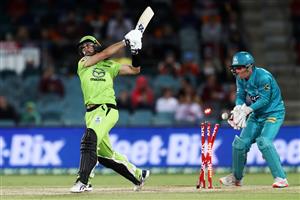 CANBERRA, AUSTRALIA - DECEMBER 14: Alex Ross of the Thunder
is bowled by Matthew Kuhnemann of the Heat during the Big Bash League match between the Sydney Thunder and the Brisbane Heat at Manuka Oval, on December 14, 2020, in Canberra, Australia. (Photo by Brendon Thorne/Getty Images)