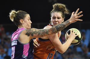 CAIRNS, AUSTRALIA - DECEMBER 11: Nadeen Payne of the Fire controls the ball under pressure from Marena Whittle of the Lightning during the round five WNBL match between the Townsville Fire and the Adelaide Lightning at Cairns Pop Up Arena, on December 11, 2020, in Cairns, Australia. (Photo by Albert Perez/Getty Images)