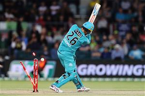 CANBERRA, AUSTRALIA - DECEMBER 14: Tom Cooper of the Heat
is bowled by Nathan McAndrew of the Thunder during the Big Bash League match between the Sydney Thunder and the Brisbane Heat at Manuka Oval, on December 14, 2020, in Canberra, Australia. (Photo by Brendon Thorne/Getty Images)