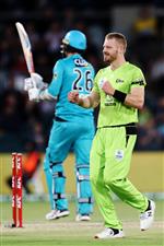 CANBERRA, AUSTRALIA - DECEMBER 14: Nathan McAndrew of the Thunder celebrates after claiming the wicket of Tom Cooper of the Heat during the Big Bash League match between the Sydney Thunder and the Brisbane Heat at Manuka Oval, on December 14, 2020, in Canberra, Australia. (Photo by Brendon Thorne/Getty Images)