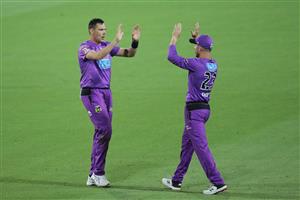 LAUNCESTON, AUSTRALIA - DECEMBER 15: Scott Boland of the Hurricanes (L) celebrates with D'Arcy Short (R) after taking the wicket of Alex Carey of the Strikers during the Big Bash League match between Hobart Hurricanes and Adelaide Strikers at University of Tasmania Stadium, on December 15, 2020, in Launceston, Australia. (Photo by Matt King/Getty Images)