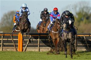 WINCANTON, ENGLAND - DECEMBER 15: Micheal Nolan riding Pol Crocan (L, blue) on their way to winning The Every Race Live On Racing TV Maiden Hurdle at Wincanton Racecourse on December 15, 2020 in Wincanton, England. Owners and a limited number of the public are allowed to attend the meeting due to the Coronavirus pandemic. (Photo by Alan Crowhurst/Getty Images)