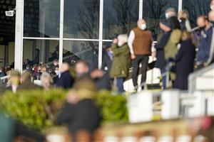 WINCANTON, ENGLAND - DECEMBER 15: A good sized crowd watch the action at Wincanton Racecourse on December 15, 2020 in Wincanton, England. Owners and a limited number of the public are allowed to attend the meeting due to the Coronavirus pandemic. (Photo by Alan Crowhurst/Getty Images)