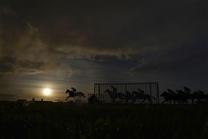 WINCANTON, ENGLAND - DECEMBER 15: A general view as runners clear a flight of hurdles during The Racing TV Profits Returned To Racing Handicap Hurdle at Wincanton Racecourse on December 15, 2020 in Wincanton, England. Owners and a limited number of the public are allowed to attend the meeting due to the Coronavirus pandemic. (Photo by Alan Crowhurst/Getty Images)