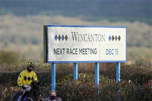 WINCANTON, ENGLAND - DECEMBER 15: A general view as a runner makes its way to the track for the first race of the day at Wincanton Racecourse on December 15, 2020 in Wincanton, England. Owners and a limited number of the public are allowed to attend the meeting due to the Coronavirus pandemic. (Photo by Alan Crowhurst/Getty Images)