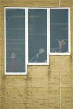 WINCANTON, ENGLAND - DECEMBER 15: Racegoers watch the action from the comfort of the grandstand at Wincanton Racecourse on December 15, 2020 in Wincanton, England. Owners and a limited number of the public are allowed to attend the meeting due to the Coronavirus pandemic. (Photo by Alan Crowhurst/Getty Images)