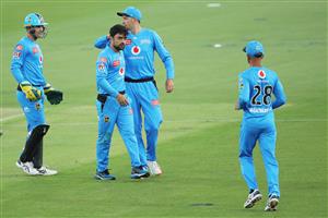 LAUNCESTON, AUSTRALIA - DECEMBER 15: Rashid Khan of the Strikers celebrates with team mates after taking the wicket of Ben McDermott of the Hurricanes during the Big Bash League match between Hobart Hurricanes and Adelaide Strikers at University of Tasmania Stadium, on December 15, 2020, in Launceston, Australia. (Photo by Matt King/Getty Images)