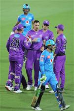 LAUNCESTON, AUSTRALIA - DECEMBER 15: Scott Boland of the Hurricanes celebrates with team mates after taking the wicket of Alex Carey of the Strikers during the Big Bash League match between Hobart Hurricanes and Adelaide Strikers at University of Tasmania Stadium, on December 15, 2020, in Launceston, Australia. (Photo by Matt King/Getty Images)