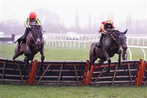 NEWBURY, ENGLAND - DECEMBER 16: Tom O'Brien riding French Paradoxe (R) clear the last to win The Every Race Live On Racing TV EBF Stallions 'National Hunt' Novices' Hurdle from Harry Skelton and Flash Collonges at Newbury Racecourse on December 16, 2020 in Newbury, England. Owners and a limited number of the public are allowed to attend the meeting due to the Coronavirus pandemic. (Photo by Alan Crowhurst/Getty Images)