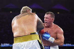 SYDNEY, AUSTRALIA - DECEMBER 16: Paul Gallen and Mark Hunt compete during the Main Event fight prior to the light-middleweight World Title elimination bout between Tim Tszyu and Bowyn Morgan at Bankwest Stadium on December 16, 2020 in Sydney, Australia. (Photo by Brett Hemmings/Getty Images)