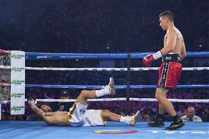 SYDNEY, AUSTRALIA - DECEMBER 16: Tim Tszyu knocks down Bowyn Morgan during the light-middleweight World Title elimination bout between Tim Tszyu and Bowyn Morgan at Bankwest Stadium on December 16, 2020 in Sydney, Australia. (Photo by Brett Hemmings/Getty Images)