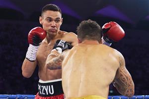 SYDNEY, AUSTRALIA - DECEMBER 16: Tim Tszyu and Bowyn Morgan compete during the light-middleweight World Title elimination bout between Tim Tszyu and Bowyn Morgan at Bankwest Stadium on December 16, 2020 in Sydney, Australia. (Photo by Brett Hemmings/Getty Images)