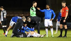 PAISLEY, SCOTLAND - DECEMBER 16: Leon Balogun of Rangers receives treatment and goes off injured as Jermain Defoe of Rangers reacts during the Betfred Cup Quarter-Final match between St Mirren and Rangers at The Simple Digital Arena on December 16, 2020 in Paisley, Scotland. The match will be played without fans, behind closed doors as a Covid-19 precaution. (Photo by Ian MacNicol/Getty Images)