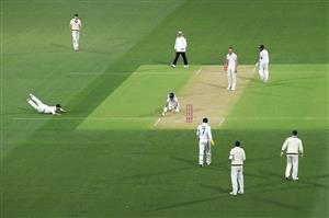 ADELAIDE, AUSTRALIA - DECEMBER 17: Ajinkya Rahane of India avoids a run-out attempt by Travis Head of Australia during day one of the First Test match between Australia and India at Adelaide Oval on December 17, 2020 in Adelaide, Australia. (Photo by Cameron Spencer/Getty Images)