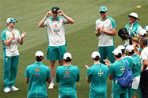 ADELAIDE, AUSTRALIA - DECEMBER 17: Cameron Green of Australia is presented is Test Cap on debut day one of the First Test match between Australia and India at Adelaide Oval on December 17, 2020 in Adelaide, Australia. (Photo by Cameron Spencer/Getty Images)