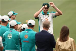 ADELAIDE, AUSTRALIA - DECEMBER 17: Cameron Green of Australia receives his Baggy Green Cap during day one of the First Test match between Australia and India at Adelaide Oval on December 17, 2020 in Adelaide, Australia. (Photo by Ryan Pierse/Getty Images)