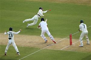 ADELAIDE, AUSTRALIA - DECEMBER 17: Travis Head of Australia attempts to catch Cheteshwar Pujara of India plays a shot during day one of the First Test match between Australia and India at Adelaide Oval on December 17, 2020 in Adelaide, Australia. (Photo by Cameron Spencer/Getty Images)