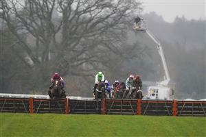 ASCOT, ENGLAND - DECEMBER 18: Joe Anderson riding Emir Sacree (green) clear the last to win The ITV7 100k Jackpot On Boxing Day Conditional Jockeys' Handicap Hurdle at Ascot Racecourse on December 18, 2020 in Ascot, England. Owners are allowed to attend if they have a runner at the meeting otherwise racing remains behind closed doors to the public due to the Coronavirus pandemic. (Photo by Alan Crowhurst/Getty Images)