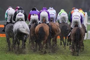 ASCOT, ENGLAND - DECEMBER 18: A general view as runners in The ITV7 100k Jackpot On Boxing Day Conditional Jockeys' Handicap Hurdle take a hurdle down the side of the rack at Ascot Racecourse on December 18, 2020 in Ascot, England. Owners are allowed to attend if they have a runner at the meeting otherwise racing remains behind closed doors to the public due to the Coronavirus pandemic. (Photo by Alan Crowhurst/Getty Images)