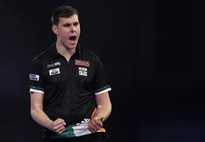 LONDON, ENGLAND - DECEMBER 18: Ciarán Teehan of Ireland reacts during his first round match against Wayne Jones of England during day four of the PDC William Hill World Darts Championship at Alexandra Palace on December 18, 2020 in London, England. (Photo by Luke Walker/Getty Images)