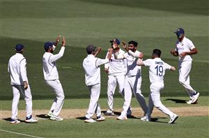 ADELAIDE, AUSTRALIA - DECEMBER 18: Jasprit Bumrah of India celebrates with team mates after dismissing Joe Burns of Australia for lbw during day two of the First Test match between Australia and India at Adelaide Oval on December 18, 2020 in Adelaide, Australia. (Photo by Ryan Pierse/Getty Images)