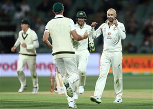 ADELAIDE, AUSTRALIA - DECEMBER 17: Nathan Lyon of Australia celebrates with Josh Hazlewood of Australia after the run-out of Virat Kohli of India during day one of the First Test match between Australia and India at Adelaide Oval on December 17, 2020 in Adelaide, Australia. (Photo by Cameron Spencer/Getty Images)