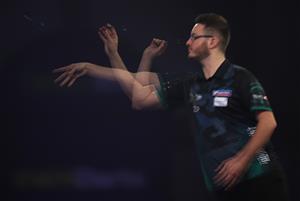 LONDON, ENGLAND - DECEMBER 18: Adam Hunt of England in action during his second round match against Jamie Hughes of England during day four of the PDC William Hill World Darts Championship at Alexandra Palace on December 18, 2020 in London, England. (Photo by Luke Walker/Getty Images)