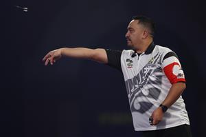 LONDON, ENGLAND - DECEMBER 18: Haupai Puha of New Zealand in action during his first round match against Mickey Mansell of Northern Ireland during day four of the PDC William Hill World Darts Championship at Alexandra Palace on December 18, 2020 in London, England. (Photo by Luke Walker/Getty Images)
