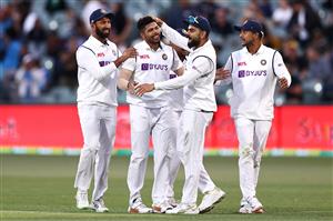 ADELAIDE, AUSTRALIA - DECEMBER 18: Umesh Yadav of India celebrates with his team mates after taking the wicket of Pat Cummins of Australia during day two of the First Test match between Australia and India at Adelaide Oval on December 18, 2020 in Adelaide, Australia. (Photo by Ryan Pierse/Getty Images)