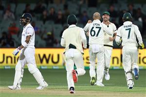 ADELAIDE, AUSTRALIA - DECEMBER 17: Nathan Lyon of Australia celebrates with Josh Hazlewood of Australia after the run-out of Virat Kohli of India during day one of the First Test match between Australia and India at Adelaide Oval on December 17, 2020 in Adelaide, Australia. (Photo by Ryan Pierse/Getty Images)
