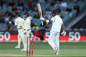 ADELAIDE, AUSTRALIA - DECEMBER 17: Virat Kohli of India celebrates reaching 50 runs during day one of the First Test match between Australia and India at Adelaide Oval on December 17, 2020 in Adelaide, Australia. (Photo by Cameron Spencer/Getty Images)