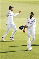 ADELAIDE, AUSTRALIA - DECEMBER 18: Virat Kohli of India celebrates taking the catch to dismiss Cameron Green of Australia during day two of the First Test match between Australia and India at Adelaide Oval on December 18, 2020 in Adelaide, Australia. (Photo by Ryan Pierse/Getty Images)