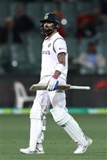 ADELAIDE, AUSTRALIA - DECEMBER 17: Virat Kohli of India walks off the field after being run-out during day one of the First Test match between Australia and India at Adelaide Oval on December 17, 2020 in Adelaide, Australia. (Photo by Ryan Pierse/Getty Images)