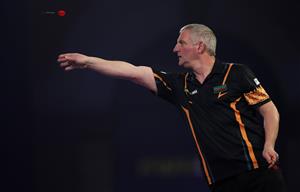 LONDON, ENGLAND - DECEMBER 18: Wayne Jones of England in action during his first round match against Ciarán Teehan of Ireland during day four of the PDC William Hill World Darts Championship at Alexandra Palace on December 18, 2020 in London, England. (Photo by Luke Walker/Getty Images)