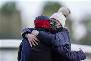ASCOT, ENGLAND - DECEMBER 19: An ecstatic Emma Lavelle (R) with husband Barry Fenton as she trains Paisley Park to win The Porsche long Walk Hurdle at Ascot Racecourse on December 19, 2020 in Ascot, England. Owners are allowed to attend if they have a runner at the meeting otherwise racing remains behind closed doors to the public due to the Coronavirus pandemic. (Photo by Alan Crowhurst/Getty Images)