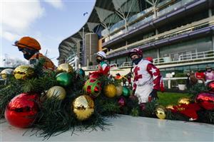 ASCOT, ENGLAND - DECEMBER 19: A general view as jockeys make their way to the parade ring at Ascot Racecourse on December 19, 2020 in Ascot, England. Owners are allowed to attend if they have a runner at the meeting otherwise racing remains behind closed doors to the public due to the Coronavirus pandemic. (Photo by Alan Crowhurst/Getty Images)