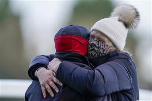 ASCOT, ENGLAND - DECEMBER 19: An ecstatic Emma Lavelle (R) with husband Barry Fenton as she trains Paisley Park to win The Porsche long Walk Hurdle at Ascot Racecourse on December 19, 2020 in Ascot, England. Owners are allowed to attend if they have a runner at the meeting otherwise racing remains behind closed doors to the public due to the Coronavirus pandemic. (Photo by Alan Crowhurst/Getty Images)