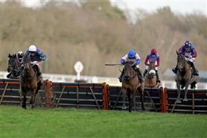 ASCOT, ENGLAND - DECEMBER 19: Aidan Coleman riding Paisley Park (R, spotted cap) clear the last to win The Porsche Long Walk Hurdle from Richard Johnson and Thyme Hill (L, white cap) at Ascot Racecourse on December 19, 2020 in Ascot, England. Owners are allowed to attend if they have a runner at the meeting otherwise racing remains behind closed doors to the public due to the Coronavirus pandemic. (Photo by Alan Crowhurst/Getty Images)