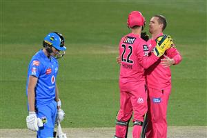HOBART, AUSTRALIA - DECEMBER 20: Steve O'Keefe of the Sixers celebrates taking the wicket of Matt Short of the Strikers during the Big Bash League match between the Sydney Sixers and the Adelaide Strikers at Blundstone Arena, on December 20, 2020, in Hobart, Australia. (Photo by Steve Bell/Getty Images)