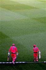 HOBART, AUSTRALIA - DECEMBER 20: Jack Edwards of the Sixers and Josh Philippe of the Sixers take the field during the Big Bash League match between the Sydney Sixers and the Adelaide Strikers at Blundstone Arena, on December 20, 2020, in Hobart, Australia. (Photo by Steve Bell/Getty Images)