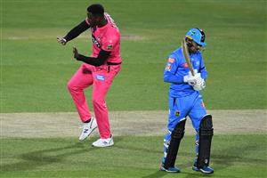 HOBART, AUSTRALIA - DECEMBER 20: Carlos Brathwaite of the Sixers celebrates taking the wicket of Rashid Khan of the Strikers during the Big Bash League match between the Sydney Sixers and the Adelaide Strikers at Blundstone Arena, on December 20, 2020, in Hobart, Australia. (Photo by Steve Bell/Getty Images)