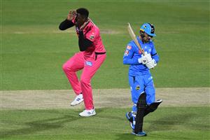 HOBART, AUSTRALIA - DECEMBER 20: Carlos Brathwaite of the Sixers celebrates taking the wicket of Rashid Khan of the Strikers during the Big Bash League match between the Sydney Sixers and the Adelaide Strikers at Blundstone Arena, on December 20, 2020, in Hobart, Australia. (Photo by Steve Bell/Getty Images)