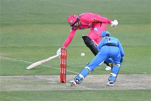 HOBART, AUSTRALIA - DECEMBER 20: James Vince of the Sixers tries to avoid being run out during the Big Bash League match between the Sydney Sixers and the Adelaide Strikers at Blundstone Arena, on December 20, 2020, in Hobart, Australia. (Photo by Steve Bell/Getty Images)