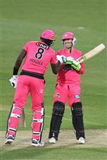 HOBART, AUSTRALIA - DECEMBER 20: Daniel Hughes of the Sixers is congratulated by Jason Holder of the Sixers after hitting a boundary during the Big Bash League match between the Sydney Sixers and the Adelaide Strikers at Blundstone Arena, on December 20, 2020, in Hobart, Australia. (Photo by Steve Bell/Getty Images)